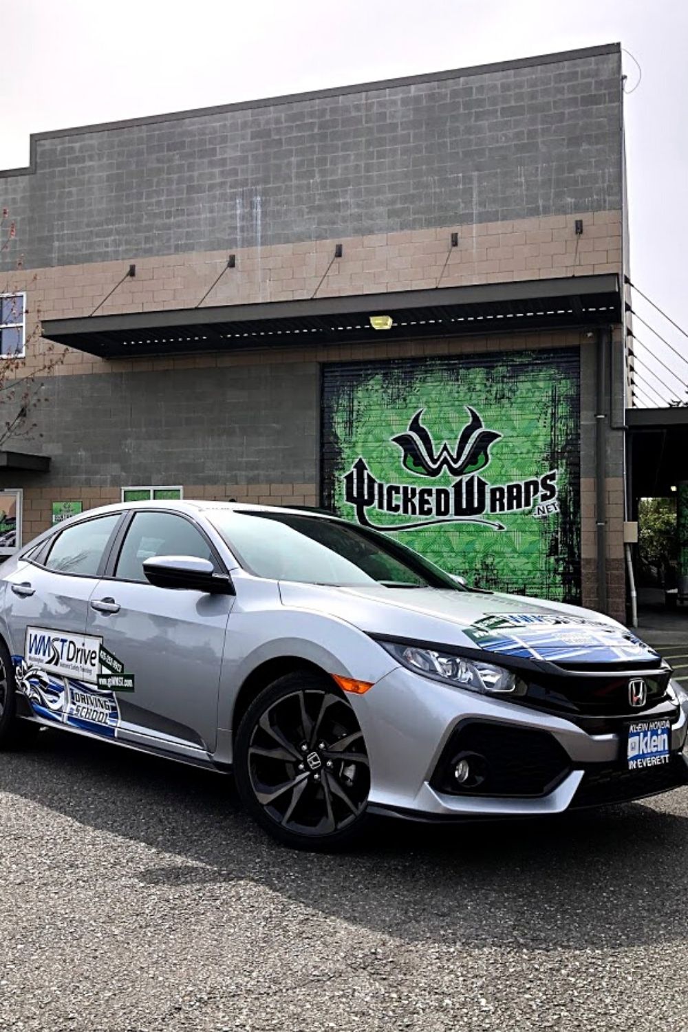 drivers education car parked in front of wicked wraps in mukilteo